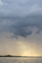 Clouds and rain over the river