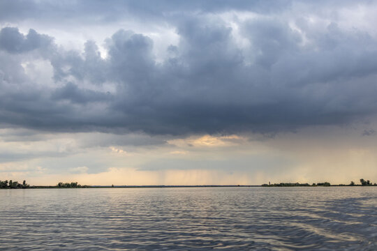 Clouds and rain over the river