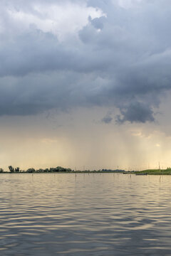 Clouds and rain over the river