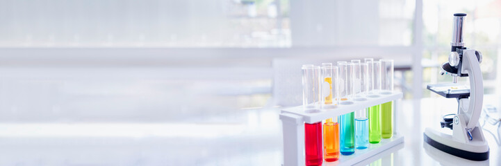 Banner Science microscope equipment in biology chemical laboratory. Scientific experiment Microscope on Lab table microbiology equipment. Banner Chemistry objects on lab background with copy space