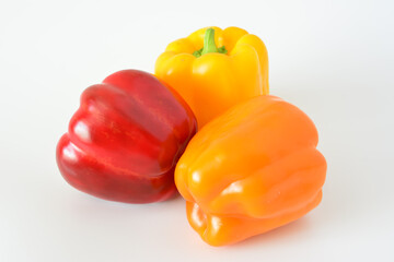 three bell peppers isolated on the white background close up