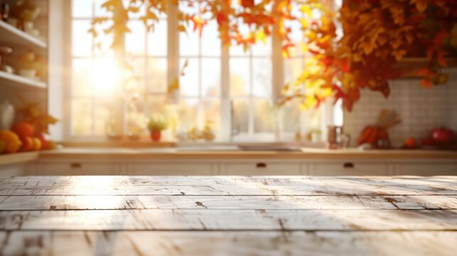 Empty wooden table illuminating by sunlight in blurred autumn kitchen background, product montage display