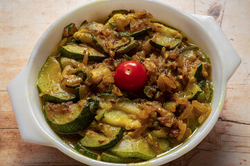 Homemade spicy zacchini or courgette curry with onions