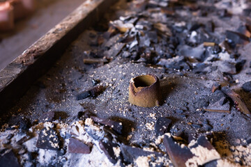 Remains of knocked out casting molds in the workshop of metallurgical plant