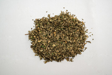 A pile of herbs and spices on a white background