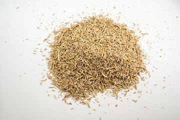 A pile of herbs and spices on a white background