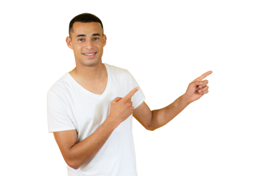 Attractive young man in casual t-shirt pointing up with his fingers isolated over transparent background