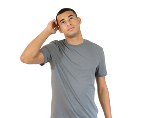 Pensive young man in casual t-shirt isolated over transparent background