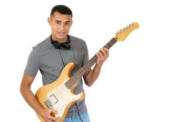 Handsome young man playing electric guitar isolated over transparent background.