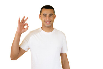 Young handsome man over isolated transparent background showing okay sign gesture