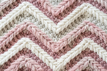 Close-Up of Textured Chevron Knit Fabric in Pink and Cream Hues