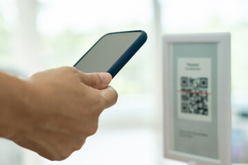 Woman use smartphone to scan QR code to pay in cafe restaurant with a digital payment without cash. Choose menu and order accumulate discount. E wallet, technology, pay online, credit card, bank app..