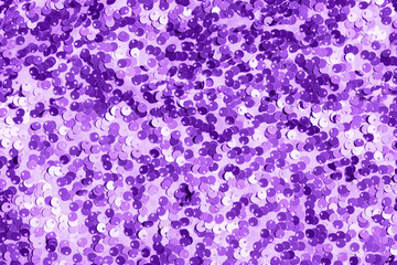 Abstract composition of fabric with shiny sequins. Holiday and party concept. Selective focus