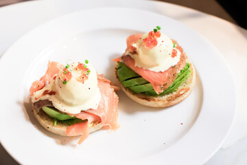 Elegant Smoked Salmon and Avocado Appetizers on a White Plate