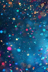 Vibrant colorful confetti glistening against a blurred blue background in celebratory atmosphere