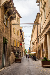 A view down a side street in the city of Urbino, Italy in summertime
