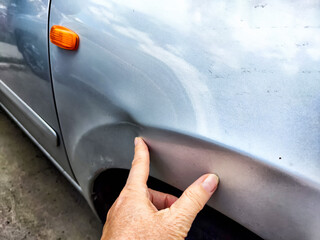 hand with car