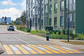 Modern multi-storey houses. Residential buildings and privacy. Barrier in front of closed territory for living. Comfortable new type of housing. 