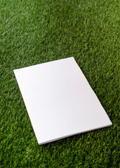 Mockup magazine on green grass background