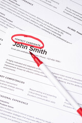 Obraz premium Fake mock CV (curriculum vitae) resume for John Smith, selected by HR as the perfect candidate for a job. Concept of job search, employee selection, recruitment process, work and hiring.