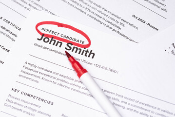 Obraz premium Fake mock CV (curriculum vitae) resume for John Smith, selected by HR as the perfect candidate for a job. Concept of job search, employee selection, recruitment process, work and hiring.