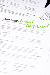 Fake mock CV (curriculum vitae) resume for John Smith, selected by HR as the perfect candidate for a job. Concept of job search, employee selection, recruitment process, work and hiring.