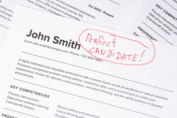 Obraz premium Fake mock CV (curriculum vitae) resume for John Smith, selected by HR as the perfect candidate for a job. Concept of job search, employee selection, recruitment process, work and hiring.