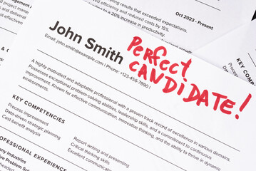Obraz premium Fake mock CV (curriculum vitae) resume for John Smith, selected by HR as the perfect candidate for a job. Concept of job search, employee selection, recruitment process, work and hiring.