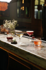 Set of various cocktails on bar counter. Assortment of alcoholic cocktails on restaurant bar