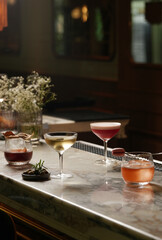 Set of various cocktails on bar counter. Assortment of alcoholic cocktails on restaurant bar