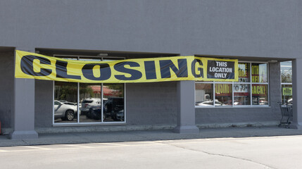 Store Closing and Going out of Business signs displayed at a soon to be closed store.