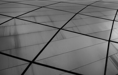 grey Geometric Pattern of Tiled Roof, tiled floor. gray concrete flooring tiles structured in perspective. iron metal background silver aluminum texture. square rhomb pattern.