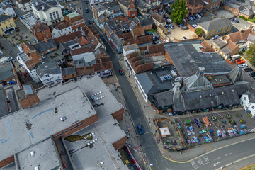 Aerial drone shot over cars driving on the road in Bishops Stortford in England