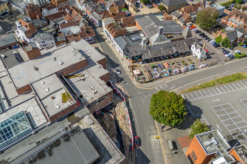 Aerial drone shot over cars driving on the road in Bishops Stortford in England