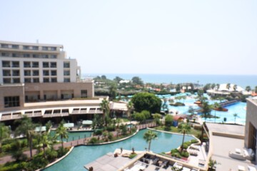 Fototapeta premium Blurred view of cityscape with luxury hotels and sea