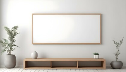 A minimalist living room with a wooden TV stand and a large empty white frame on the wall.