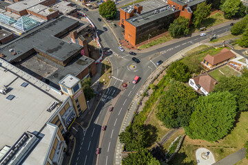 Aerial drone shot over cars driving on the road in Bishops Stortford in England