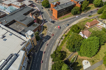 Aerial drone shot over cars driving on the road in Bishops Stortford in England