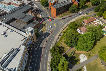 Aerial drone shot over cars driving on the road in Bishops Stortford in England