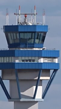 close-up aerial view left side airport control tower intricate design architecture control tower, importance airport operations close-up tower design aviation control center airport structure