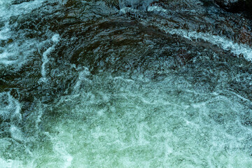 Creative shot of bubbling water of a river.