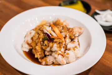 Korean Chinese Restaurant Sweet and Sour Pork with Blurred Pickled Radish and Sliced Onion