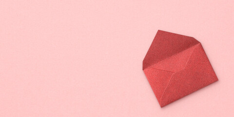 Open red envelope and copy space on pink background