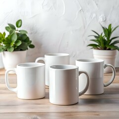 Four blank white mugs on a wooden table. perfect for your design.