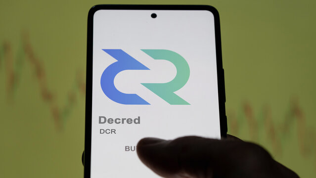 Close up on logo of (DCR) Decred on the screen of an exchange. (DCR) Decred price stocks, $DCR on a device.