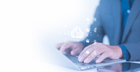 Businessmen use computers to visualize large online data in the cloud. It is a cloud server backup platform technology to ensure the safety of business data communications and data download systems.