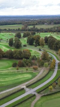 golf course country club luxury resort aerial forward movement road golf buggy carts