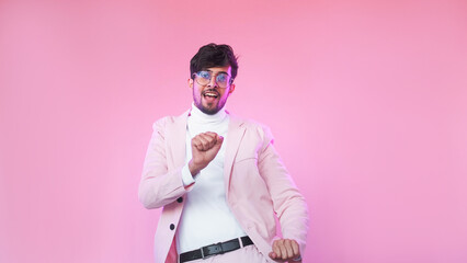Happy dance. Positive lifestyle. Neon light amused satisfied guy in glasses stylish suit enjoying...