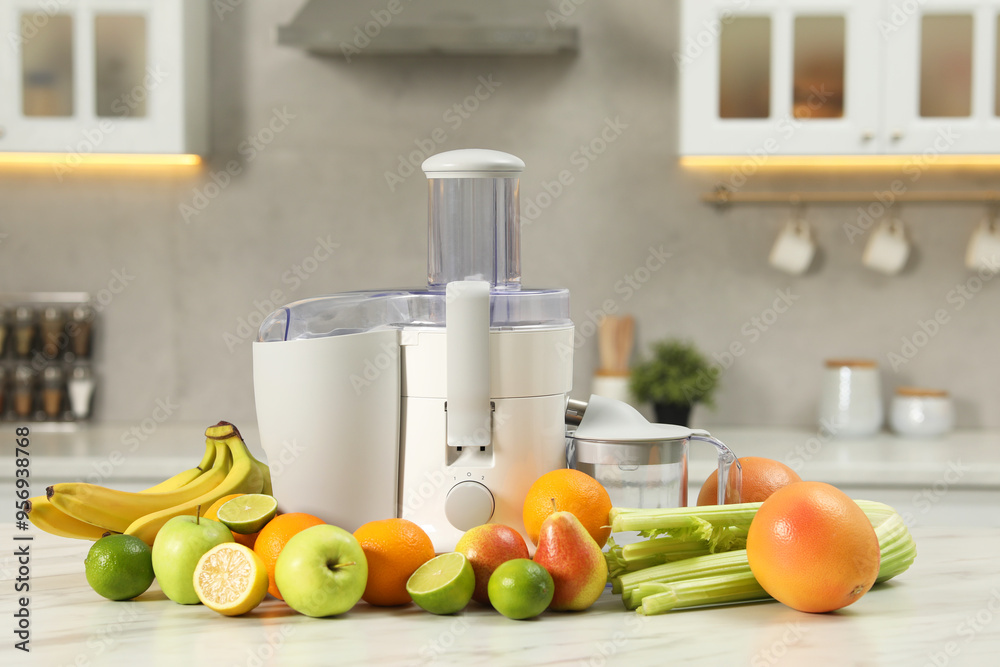 Wall mural modern juicer and fruits on white marble table in kitchen