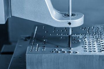 Close up scene the gun drill machine operation in the light blue scene.